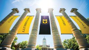 Values banners hang between the Columns on Francis Quadrangle